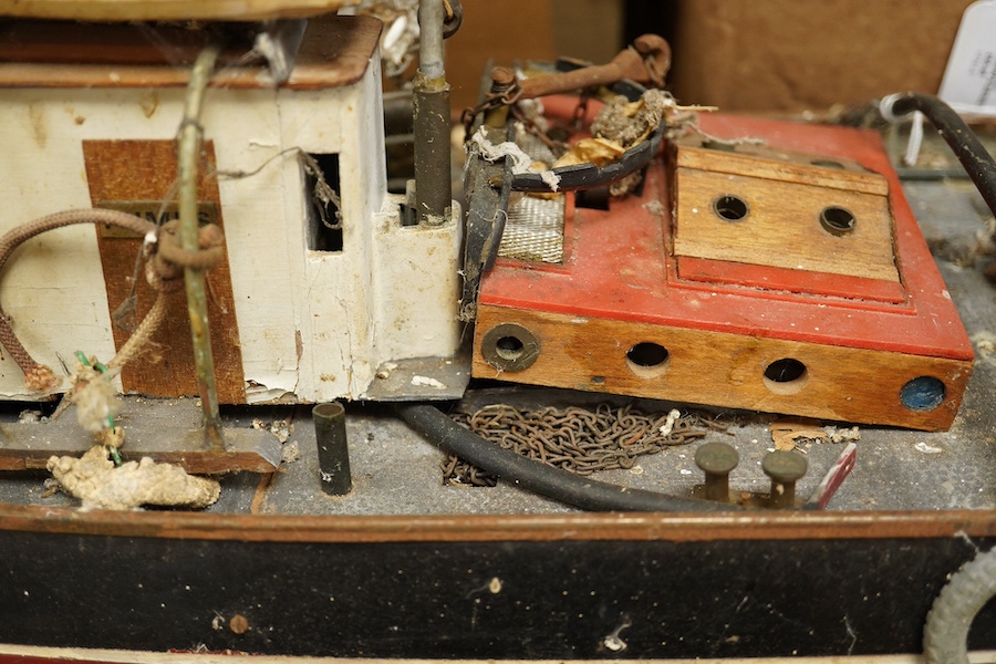A scale model of a tug boat ‘T.I.D 4’, a well detailed model with the remains of internal wiring and electric motor for use as a pond yacht, length of hull approx 92cm. Condition - poor to fair, now in need of some resto